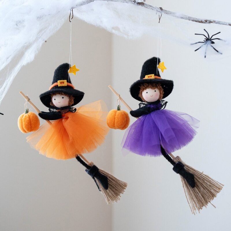 Halloween Broom Girl Angel Pendant in orange and purple silk cloth hanging on a front door
